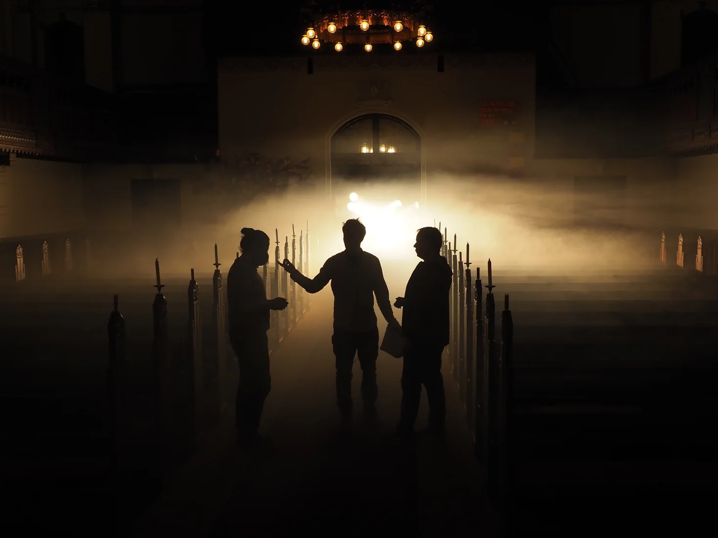 JESUSDOTCOM — silhouetted crew in warm light